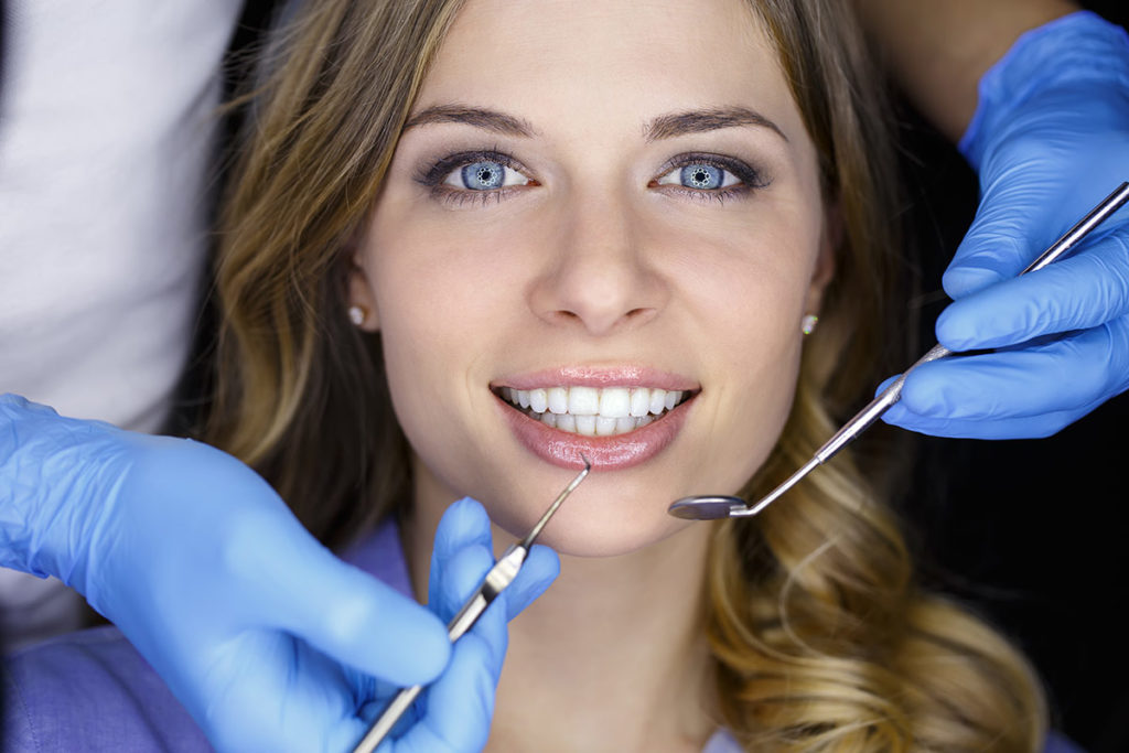 Woman having dental treatment