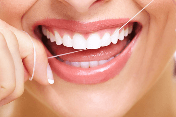 Flossing teeth